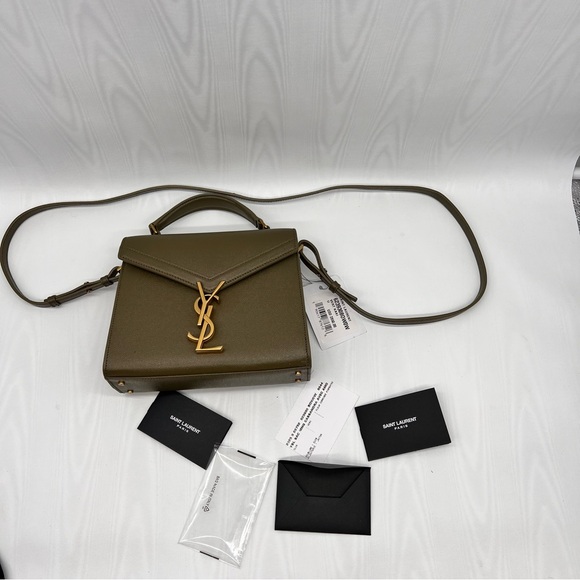 Saint Laurent
Cassandra Mini YSL Top Handle Crossbody Bag in Grained Leather - Picture 7 of 10